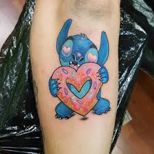 At the bottom of the tattoo, there is a man rowing a boat in water. Top 65 Best Stitch Tattoo Ideas 2021 Inspiration Guide