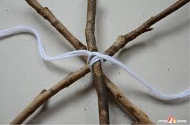 Start with one color, weave over and under until you reach the desired thickness. Stick Spider Web Spooktacular Weaving Fun Mother Natured