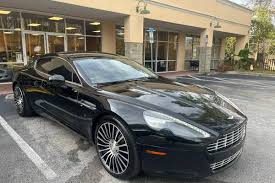 Image result for Jet Black 2012 Aston Martin