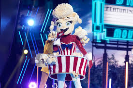 This season's costumes include baby alien, crocodile, broccoli, gremlin, mushroom, jellyfish, whatchamacalit, lips, squiggly monster, popcorn, sun, dragon, giraffe, seahorse, snow owls and serpent. Taylor Dayne Talks Being The Popcorn On The Masked Singer Ew Com