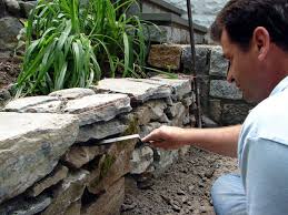 Dig a trench along where the base of each terrace will go, and place timber walls in the trenches so they don't come up more than 2 feet (0.6 m) above the surface of the ground. How To Build Tiered Garden Walls How Tos Diy