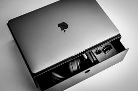 A laptop stands with multiple heights and angle adjustment for maximum comfort, compact, secure storage, and portable. Minimalistic Laptop Stand With Drawer Laptop Stand Laptop Office Items