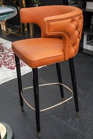 10 Ways To Welcome Orange Into Your Home S Decor Bar Stools Home Bar Accessories Orange Bar Stools