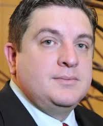 Ronda commissioner is charged