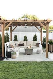 Our Backyard Reveal Get The Look Room For Tuesday Backyard Pergola Small Backyard Patio Budget Backyard