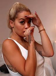 A tattoo machine has a needle that maneuvers up and down, injecting ink while puncturing the skin. Rita Ora S 25 Tattoos Their Meanings Body Art Guru