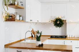 Scandinavian style kitchen with colorful details from a home of a textile designer jane foster. Small Christmas Tree In White Flower Pot White Modern Kitchen Scandinavian Style Decorated For Christmas Background Cypress Chamaecyparis Lawsoniana Ellwoodii Stock Photo Picture And Royalty Free Image Image 114520516
