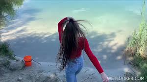 LOOK_ HOW A BEAUTIFUL GIRL POSE BY THE RIVER IN WET CLO - ThisVid.com