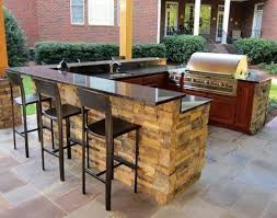 These free, diy outdoor kitchen plans will help you plan and build a new outdoor space where you can gather with friends and family to enjoy a meal. The Custom Stone Facade Of This Well Designed Kitchen Goes Perfectly With The Full Range Bluesto Outdoor Kitchen Island Backyard Kitchen Outdoor Kitchen Design