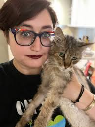 Someone got into Mom's makeup, so now he's wearing Mom's makeup. Poor cat.