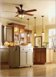 More and more modern kitchens feature breakfast bars which often replace the traditional dining area that used to no need for centre ceiling lights as the glow from the leds fill the room, being enhanced by the spots. Pendant Lighting Gives This Modern Kitchen A New Twist Ceiling Fan In Kitchen Kitchen Ceiling Modern Kitchen Interiors