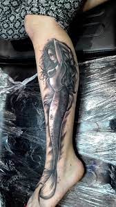 Mermaid tattoos has been known to bring luck to their wearers. Black And Gray Mermaid Tattoo Mermaid Tattoo Leg Tattoo Men Full Leg Tattoos