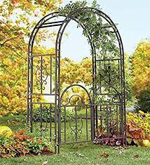 The arbor with gate adds a distinctive entry to any garden. Amazon Com Plow Hearth Montebello Decorative Scrollwork Metal Garden Arbor Landscape Accent With Gate Burnished Gunmetal Finish And 7 Ground Stakes 53 W X 23 D X 84 H Arbor