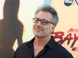 Baywatch star unrecognisable with grey hair and his shirt ON 23 years after  quitting show for normal job