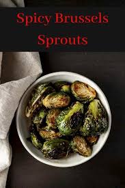 These Sweet Spicy Brussels Sprouts Are Roasted To Get Those Delicious Caramelized Edges Then Roasted Brussel Sprouts Best Vegetable Recipes Brussel Sprouts