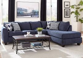 Featuring a classic design, this sofa is great for creating an appearance that is comforting and inviting. Albany Endurance Denim Chaise Sectional With Harlequin Blue And Arrowhead Denim Accent Pillows