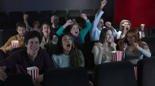 Excited Audience Cheering and Enjoying 3d Movie in Cinema