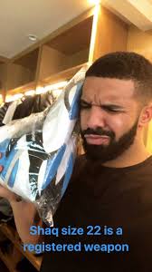 Drake with Shaq's shoes. 😂