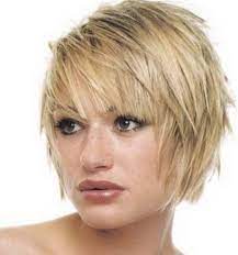 A basic bob can turn into a fashionably textured hairstyle like this wavy semi short cut paired with wispy bangs to balance the look. Short Feathered Hairstyles Choppy Hair Short Hair Styles Short Emo Hair