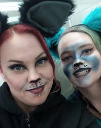 Someone got into Mom's makeup, so now he's wearing Mom's makeup. Poor cat.