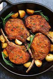 Tender And Juicy Pan Fried Pork Chops In A Cast Iron Skillet With Sprigs Of Fresh Rosemary And Saut Fried Pork Chops Cooking Pork Chops Fried Pork Chop Recipes