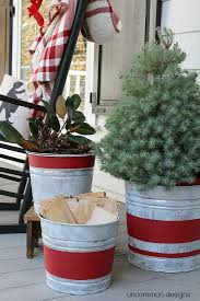 A heavy galvanized bucket with a metal and wood handle. 30 Diy Outdoor Christmas Decorations Best Holiday Porch Decor