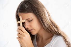 Religious Christian Woman Disciple Praying To God With Holy Cross Stock  Photo, Picture and Royalty Free Image. Image 151171935.