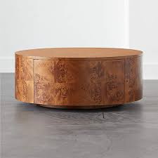 A simple but elegant rustic coffee table supported by metal legs. Purl Rotating Coffee Table Reviews Cb2