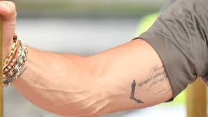 Pitt walked around with his sleeve rolled up, showing off an older tattoo that has the initials of angelina and the six children they share represented on a long cross. Brad Pitt Appears To Have A New Tattoo Next To His Angelina Jolie Ink Entertainment Tonight