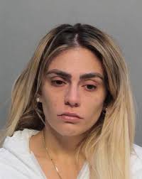 An Instagram model from Florida has been charged after allegedly shooting  her ex-boyfriend 15 times and killing him outside of his home. Karina  Vanessa Corbalan, 23, was seen in news chopper video