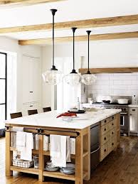 Kitchen island mounted on metal base and fitted with wheels for easy movement. Kitchen Island Ideas Open Shelving Storage Apartment Therapy