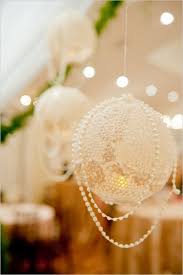 A wedding chair covered with fabric, pink blooms and pearls is a creative take on wedding signage that you a chic and glam wedding table number in a pearl frame is a cool idea to accent your table. 60 Prettiest Pearl Wedding Inspirational Ideas Weddingomania