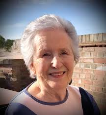 Could someone please fix this photo for a friend of mine so that the side  panel of brick etc blends in with the wall to be a plain background? Thank  you so