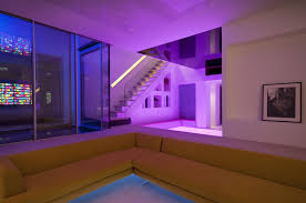 Lightwell Using Sliding Glass Doors And A Frameless Balustrade To The Stairs Allow Natural Light Into This Basement Dream House Disco Floor Building A House