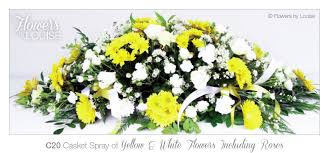 Gardenias are extremely airy and elegant flowers. Casket Spray Of Yellow White Flowers Including Roses Holy Cross Funerals