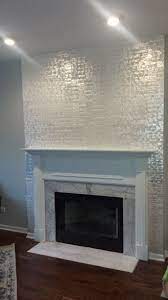 What makes these buttons so iconic is their inimitable pearly finish. Maya Romanoff S Mother Of Pearl Wall Covering On A Traditional Fireplace Who Needs Art Traditional Fireplace Mantel Traditional Fireplace Wallpaper Fireplace