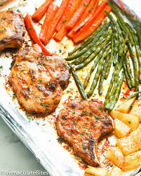 Brush the pork chops with oil, reserving 1 tbsp of it for the green beans. Oven Baked Pork Chops Immaculate Bites