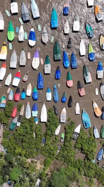 Fishing boats lie anchored along the Arabian Sea coast at Uttan Beach on the outskirts of Mumbai, Sunday, June 14, 2026, as the annual fishing season draws to a close ahead of the monsoon fishing ban. ...