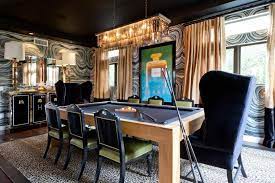 Birds of a feather design and hooper patterson interior design for that classic country look, this dining table features linen and burlap table runners with a wire basket of eggs, crystal and candles. Eclectic Masculine Dining Room With Pool Table Hgtv