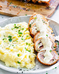 Ingredients · 2 boneless skinless chicken breast halves (6 ounces each) · 2 slices deli ham · 2 slices gruyere or swiss cheese · 1/4 cup butter, melted · 1/2 cup dry . Chicken Cordon Bleu Jo Cooks