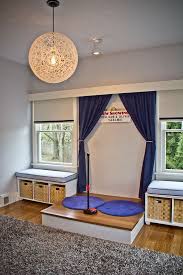 How an older child chooses to play may depend on how they feel at the moment or a personal preference. Children S Play Area Stage Playroom Stage Childrens Playroom Playroom Design