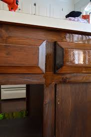 Wipe off excess stain with a piece of clean cotton cloth. Using Polyshades To Darken Our Wood Cabinets Young House Love
