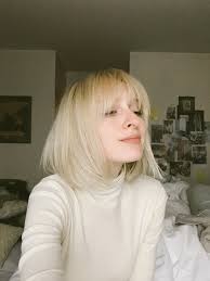 A short blonde hairstyle is the perfect fresh new look for the spring and summer months. Short Blonde Hair 70s Bangs Hair Styles Straight Hairstyles Short Blonde Hair