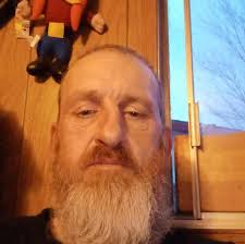 What is causing my motorized bicycle carburetor to pop back through the  carb with a 65 jet?