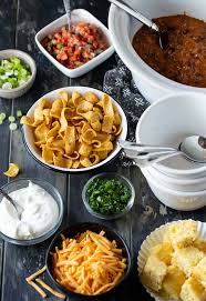 The best chili is one that's simmered for as many hours as you can give it, so that the flavors have time to mix and mingle. How To Host A Chili Bar Party Garnish With Lemon