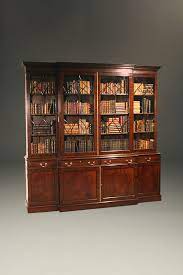 We offer mahogany bookcases with three to six shelves, so you can effortlessly store books, vinyl records, board games, and whatever your heart desires. Custom English Mahogany Georgian Breakfront Bookcase
