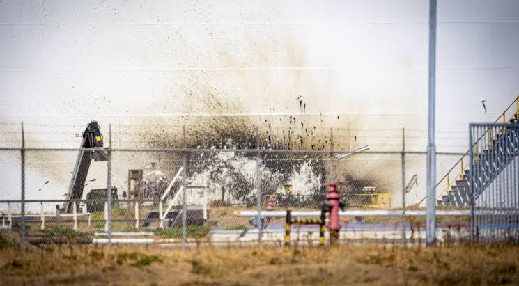 Emergency services responding to the scene of an explosion at an industrial energy facility in the Port of Rotterdam.