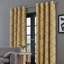 Often an overlooked detail, curtains can significantly impact a room's style and comfort level. Catherine Lansfield Aztec Ochre Eyelet Curtains Catherine Lansfield Curtains Home Decor