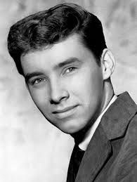 Gary Wayne Schelton (1939-2016) also known as Troy Shondell: Gary, who  cited his father as a major influence, learned to play 5 instruments. He  wrote his first song at age 14. In