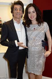 Ronnie wood in the stage Ronnie Wood 68 Makes A Show Of Pregnant Wife Sally Humphreys 38 Ronnie Wood Pregnant Wife Black Pencil Dress